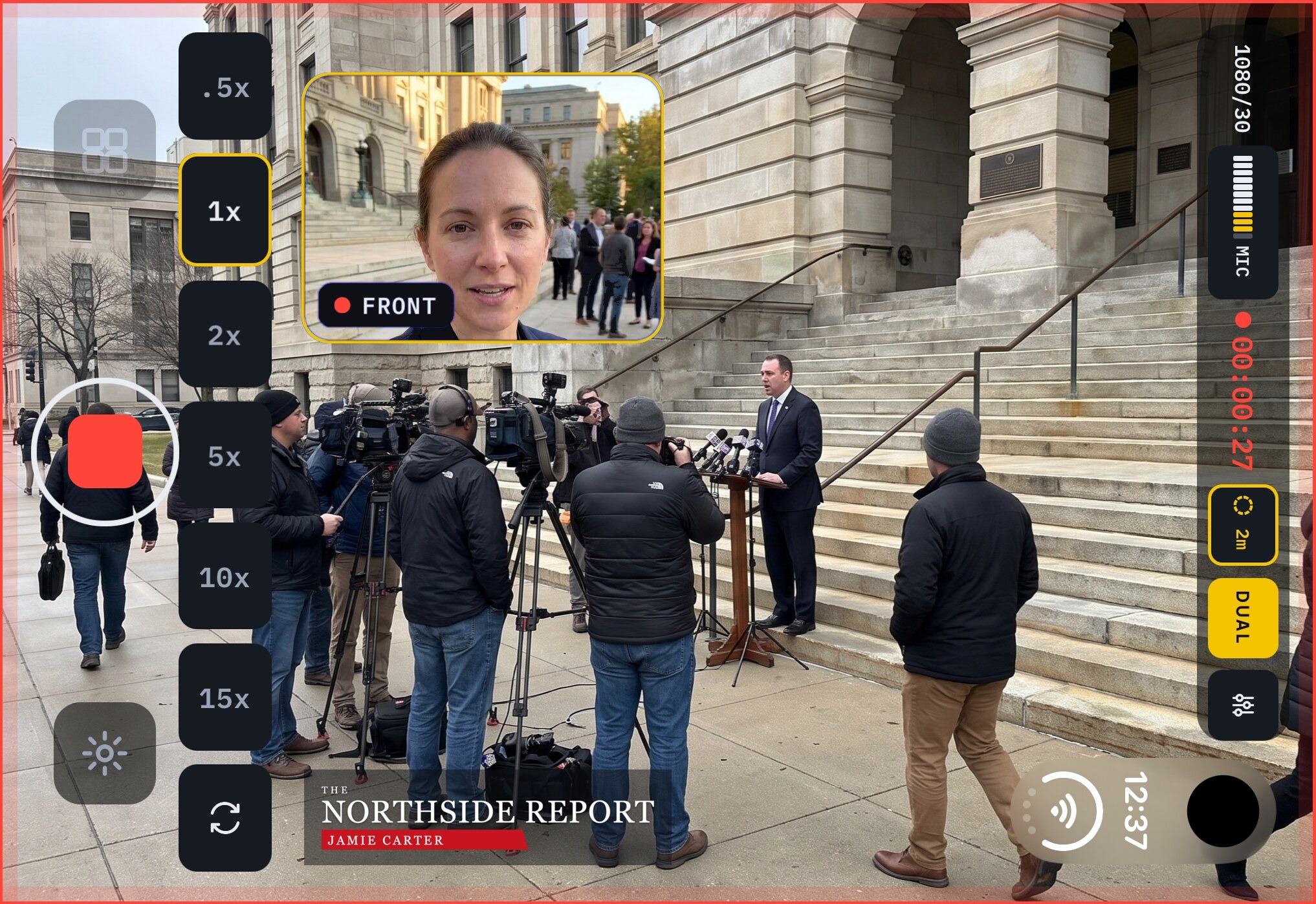 Doubleback on the open iPhone Duo, filming a courthouse press conference with the front camera inset and a station logo on the frame